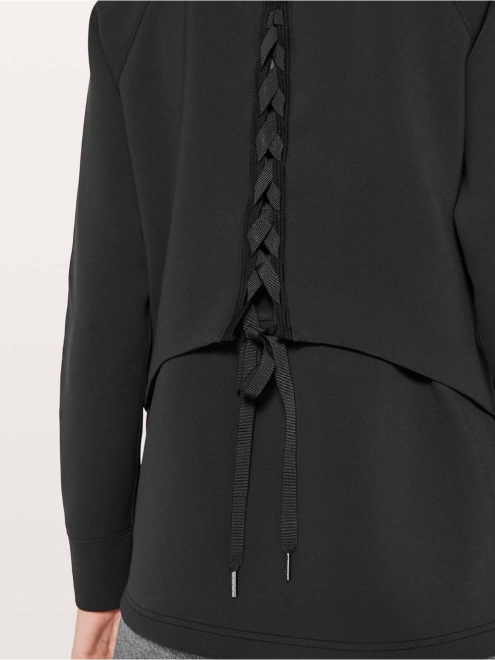Lululemon women’s size 2 black spacer jacket with lace up back. Tied to you